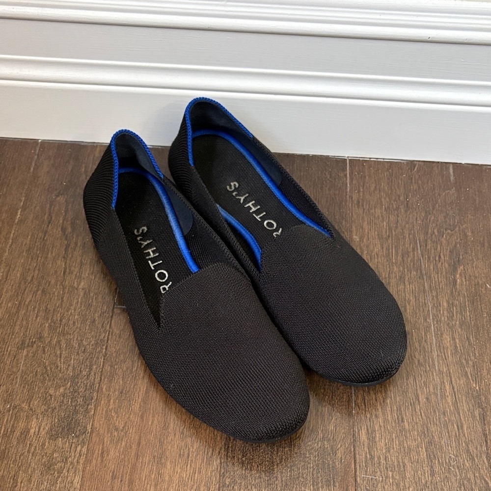 Womenβs Rothy's Black Slip-Ons with Blue Trim